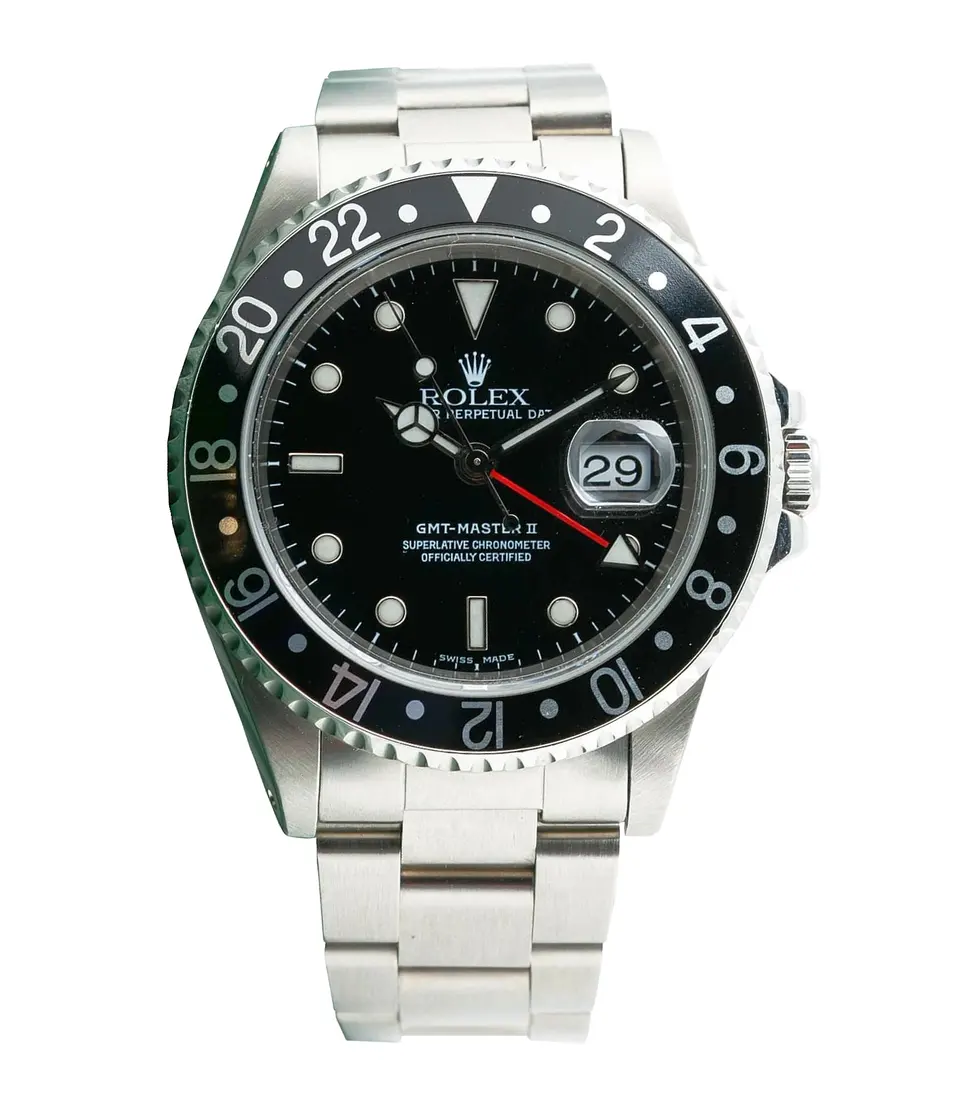 Stainless steel Rolex GMT-Master II ref. 16710 with black bezel and black dial on an Oyster bracelet, isolated on white — stand-in photograph