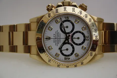 Rolex Cosmograph Daytona, 18K yellow gold, diamond-set dial — dial detail — stand-in photograph