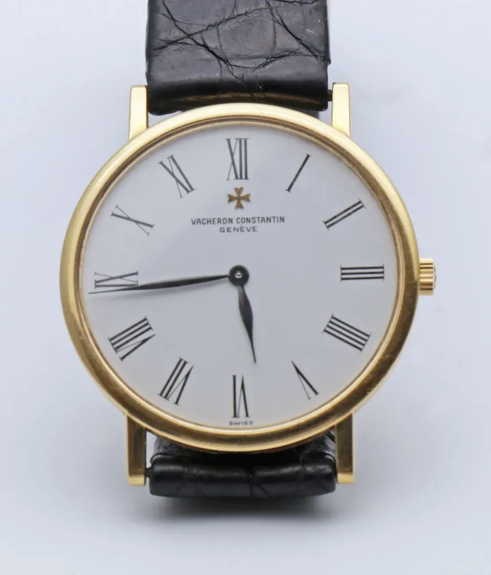 18ct yellow gold Vacheron Constantin Patrimony dress watch with white Roman-numeral dial on a black alligator strap — stand-in photograph