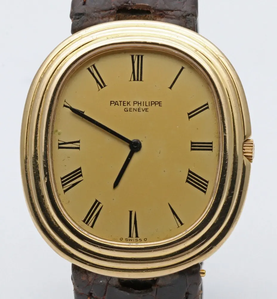 18ct gold Patek Philippe Golden Ellipse ref. 3634 with champagne dial on a dark brown strap — stand-in photograph